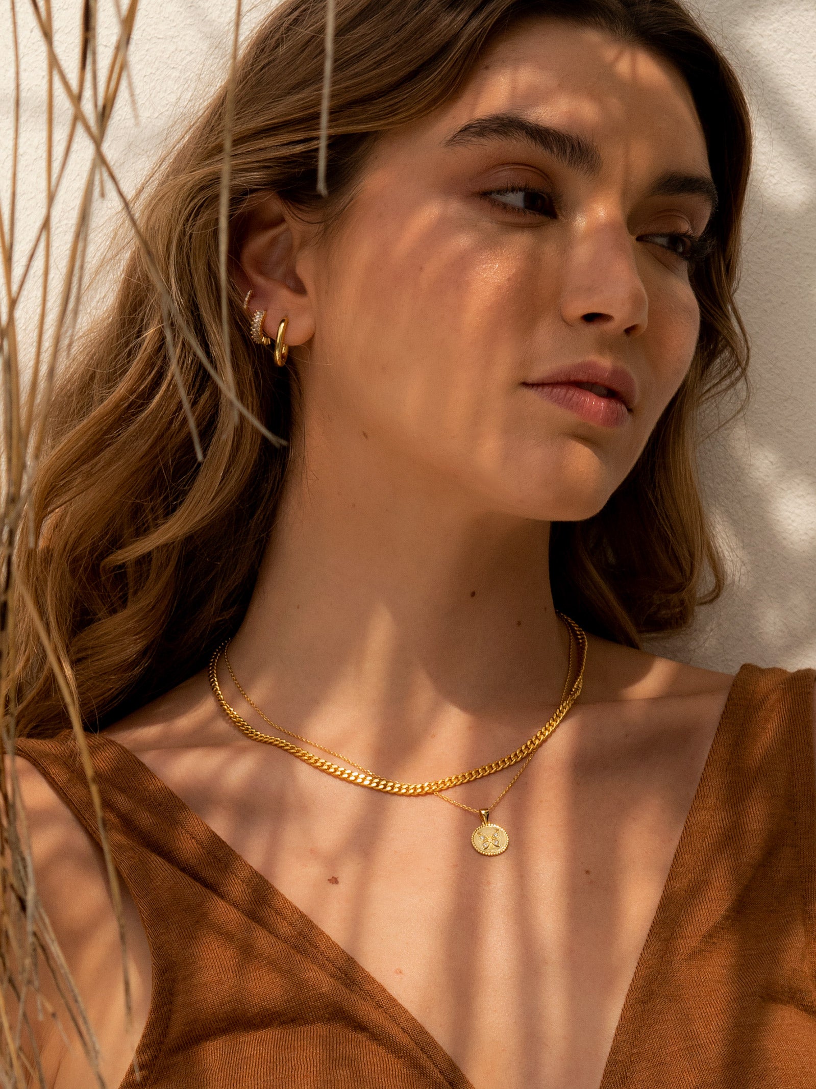 gold curb chain thin layering necklace choker herringbone layered with a butterfly coin pendant necklace