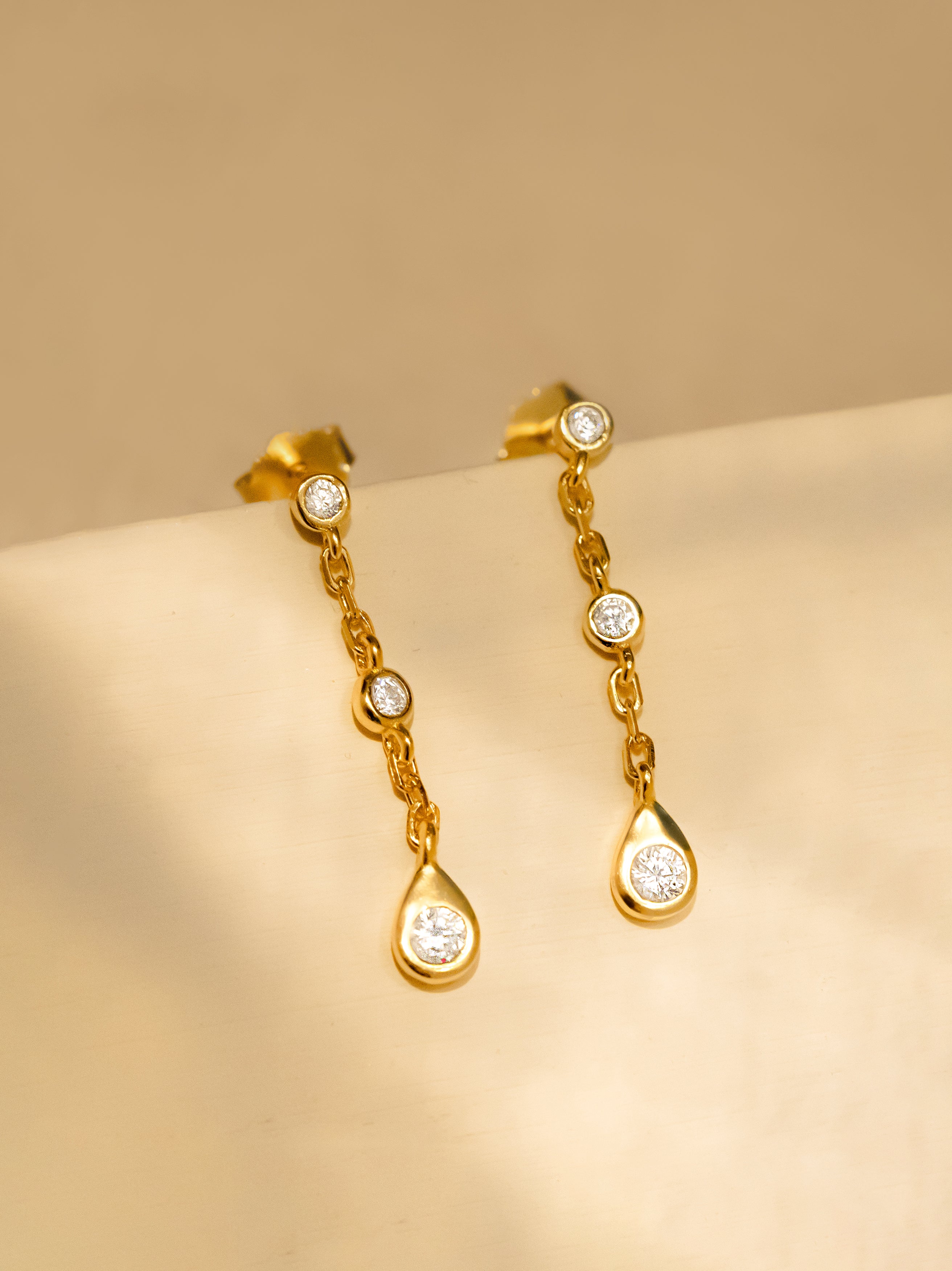 Gold Dangle Chain Earrings With White Stones