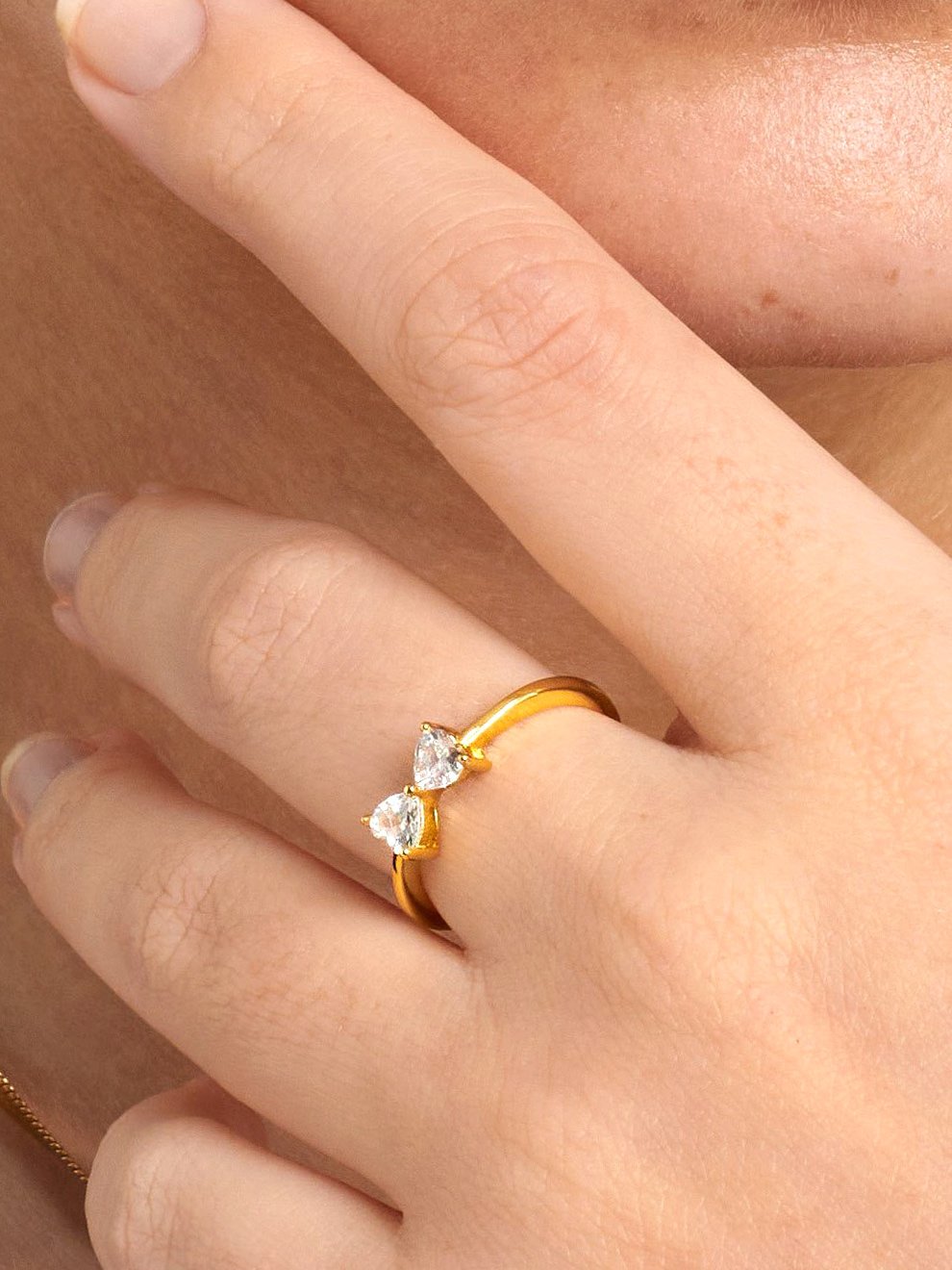 Gold ring with two hearts.