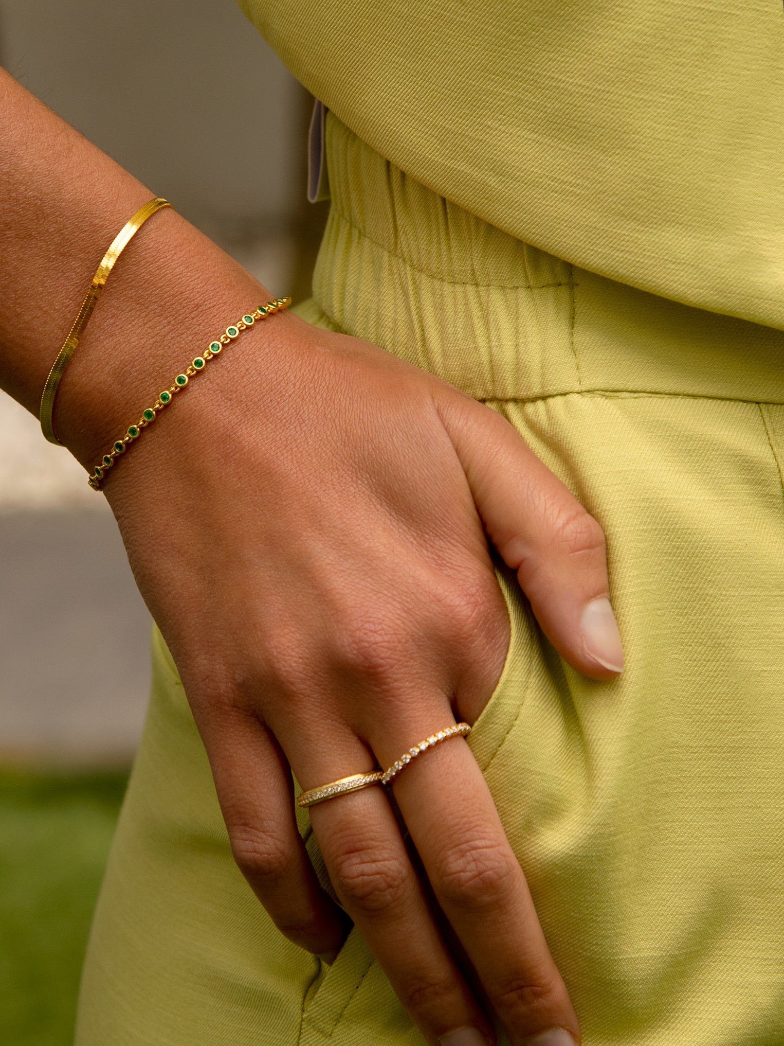 gold stacking rings for woman paired with simple minimalist layering bracelets with round stones