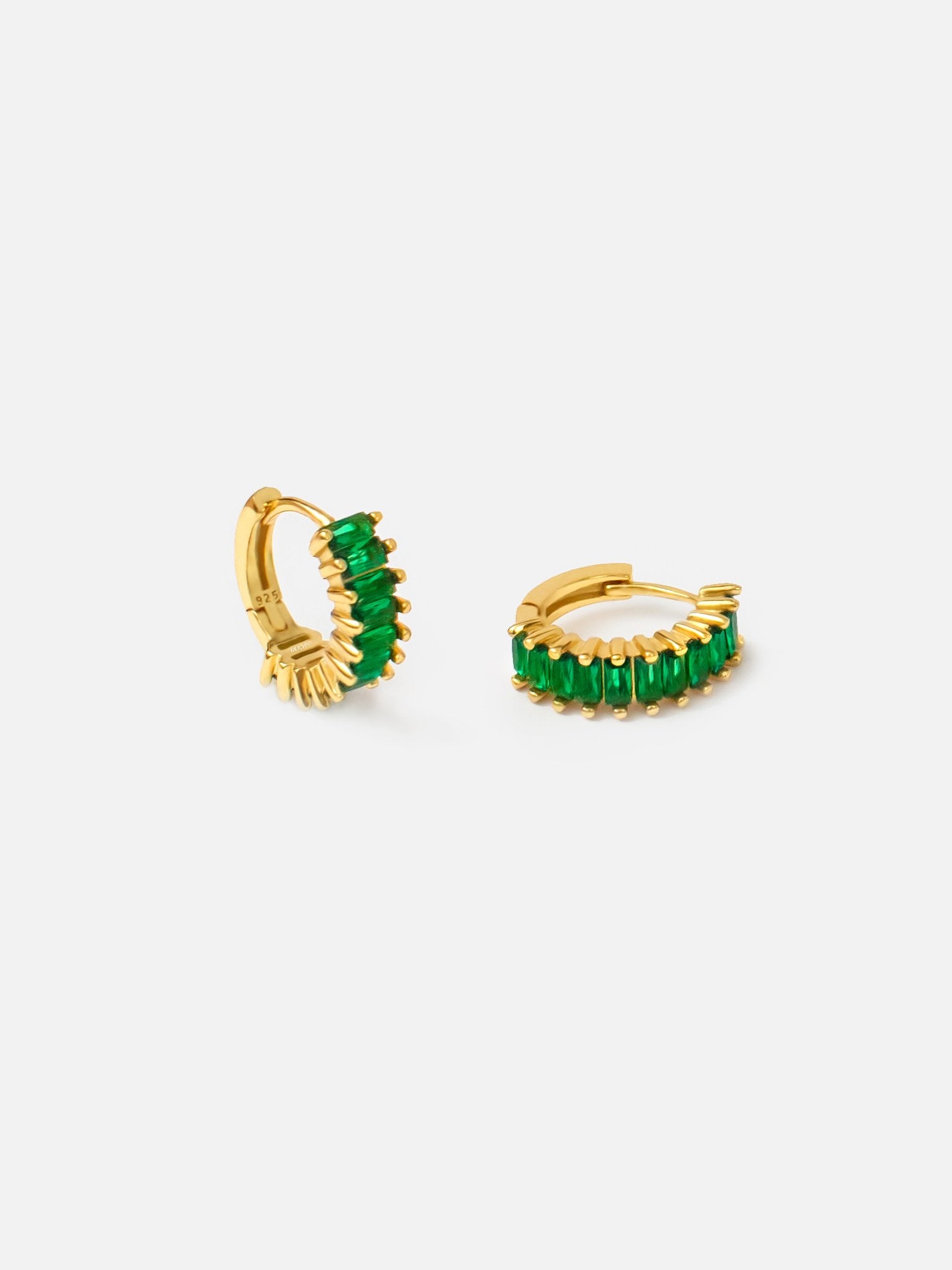 A side view of Small Emerald Green Huggie Hoop Earrings