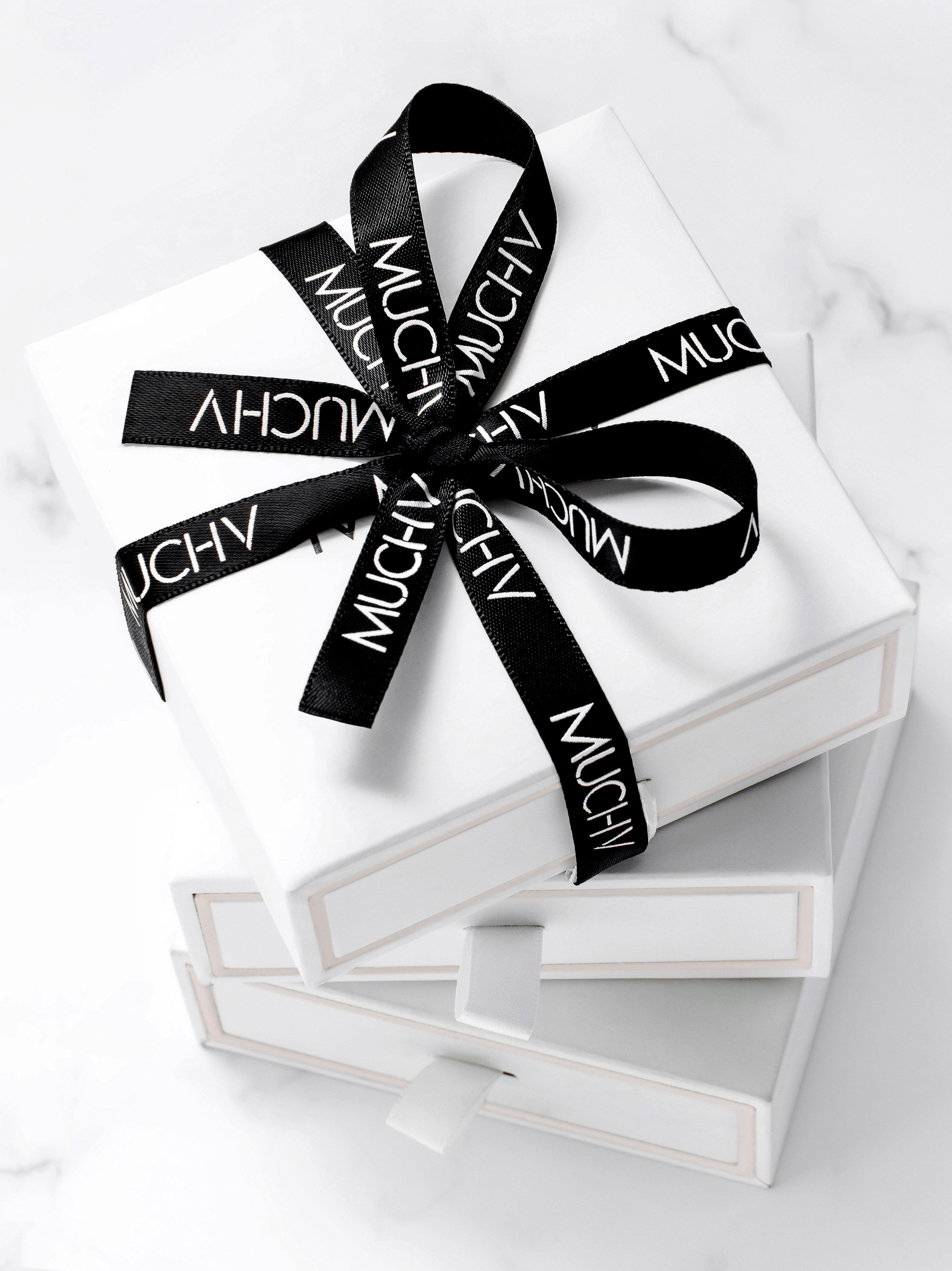 white gift box with black ribbon for hoop earrings